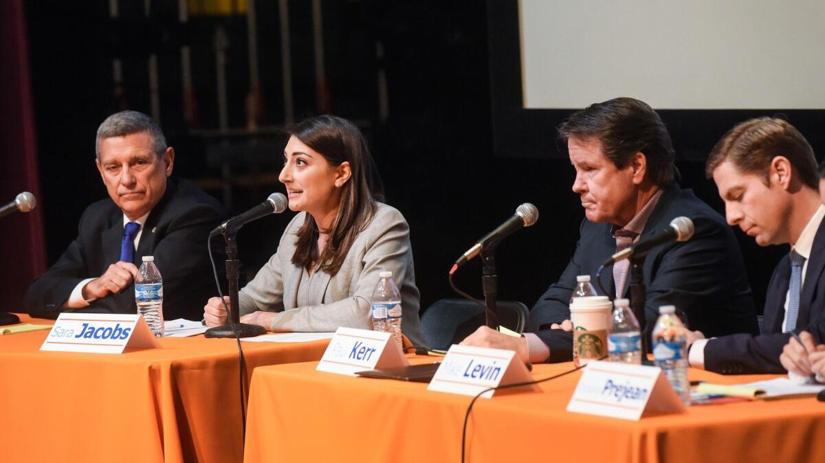 Democrats Doug Applegate, Sara Jacobs, Paul Kerr and Mike Levin, all running in the 49th Congressional District, participate in a debate at San Juan Hills High School in San Juan Capistrano in February.