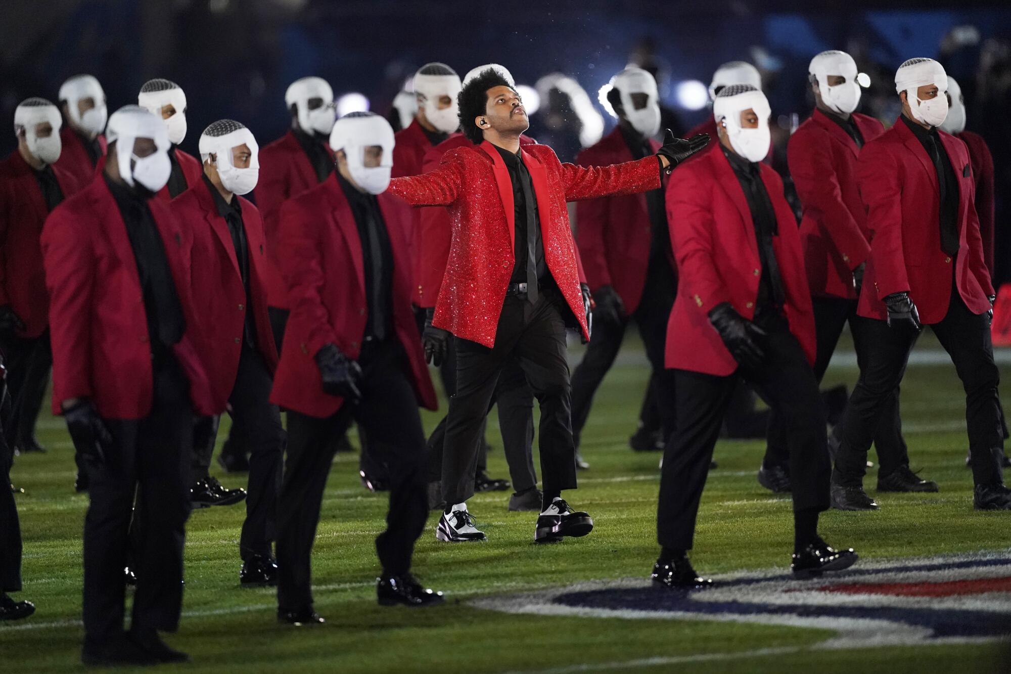 The Weeknd performs during the halftime show of Super Bowl LV.