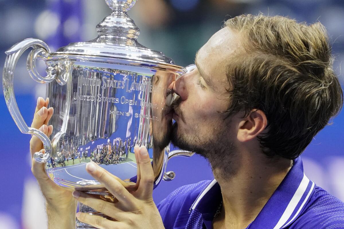Daniil Medvedev of Russia kisses the U.S. Open trophy after defeating Novak Djokovic in the men's singles final last year