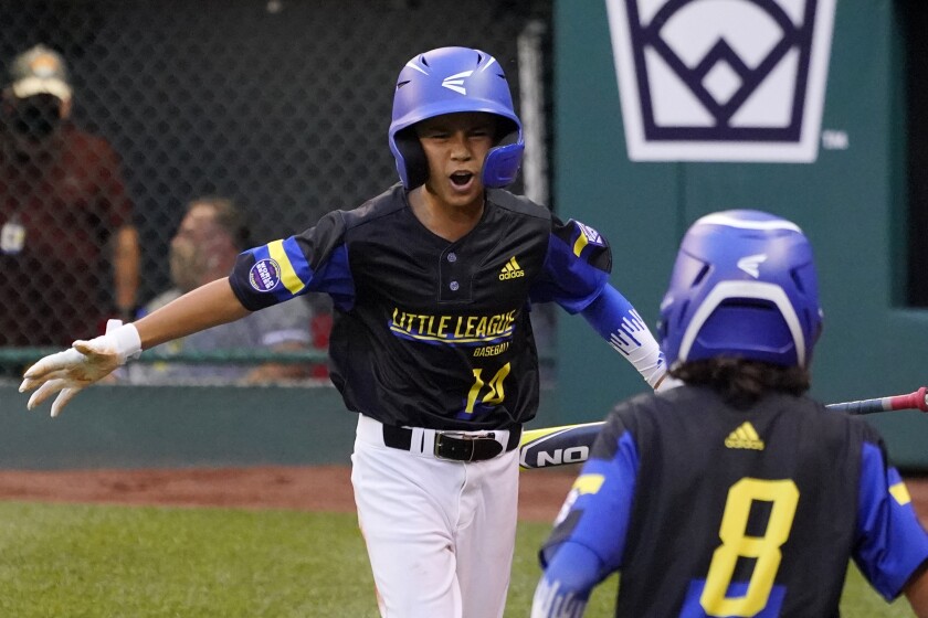 Torrance's Skylar Vinson celebrates as he returns to the dugout after scoring on a single by Elias Emerson.