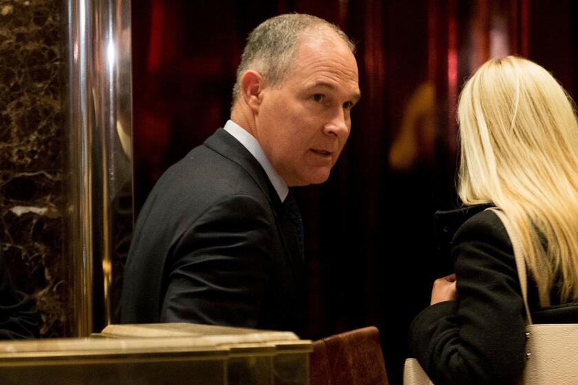 Oklahoma Atty. Gen. Scott Pruitt, a staunch ally of the fossil fuel industry and President-elect Donald Trump’s pick to run the Environmental Protection Agency, arrives at Trump Tower in New York on Dec. 7.