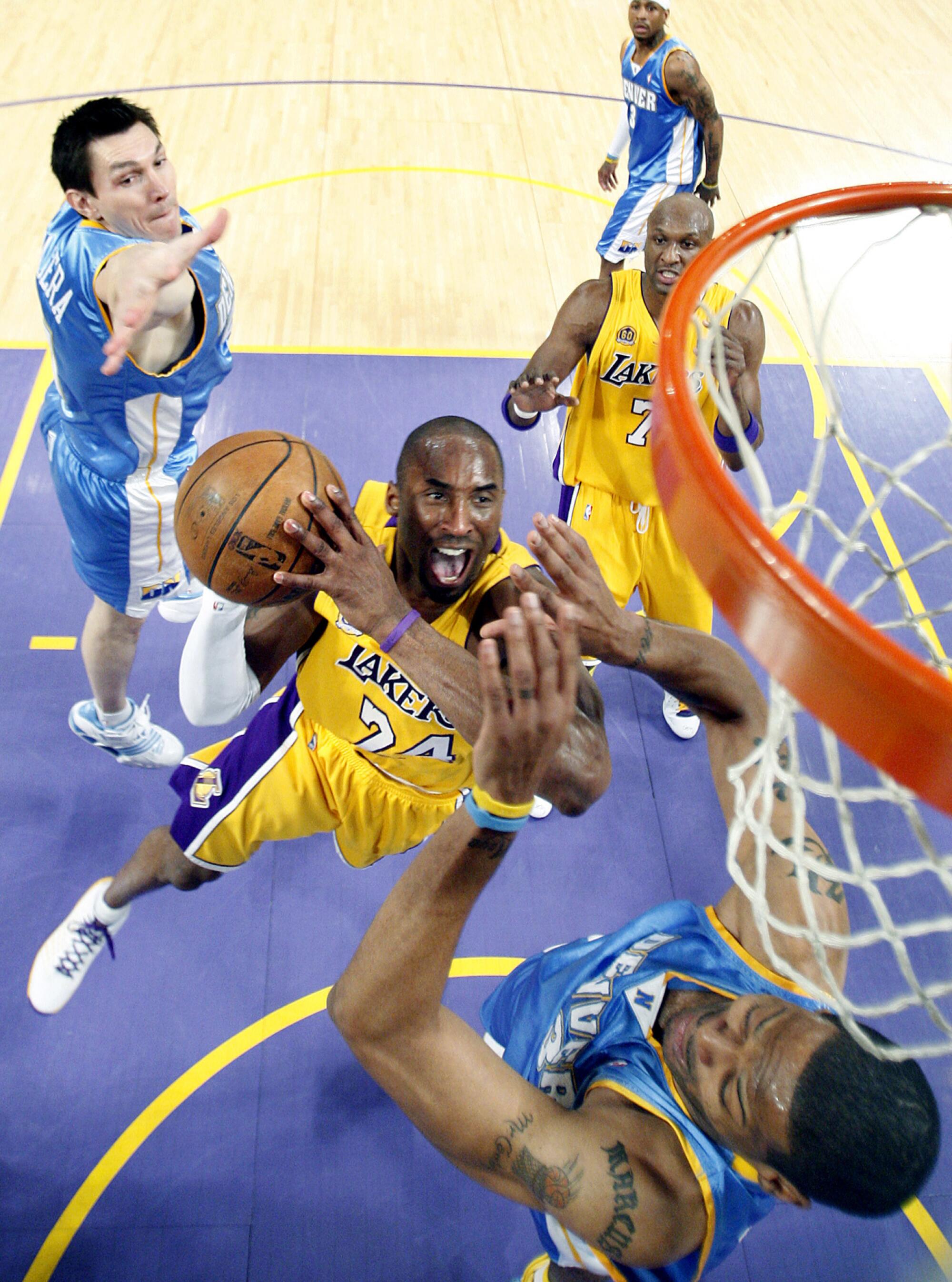Kobe Bryant drives to the basket against the Nuggets.