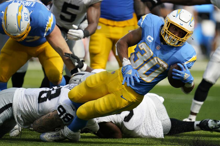 Los Angeles Chargers running back Austin Ekeler (30) runs against the Las Vegas Raiders during the second half of an NFL football game in Inglewood, Calif., Sunday, Sept. 11, 2022. (AP Photo/Marcio Jose Sanchez)