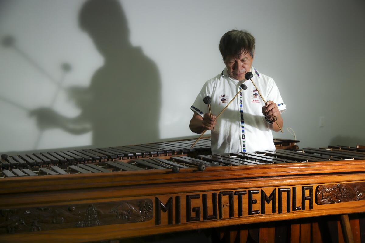 Rosauro Esteban, a Guatemalan musician, restores an old marimba