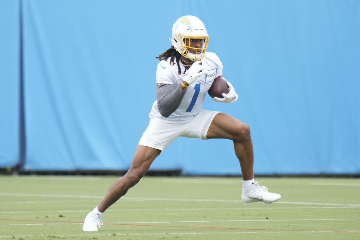 Chargers wide receiver Quentin Johnston (1) runs a drill during  rookie minicamp. 