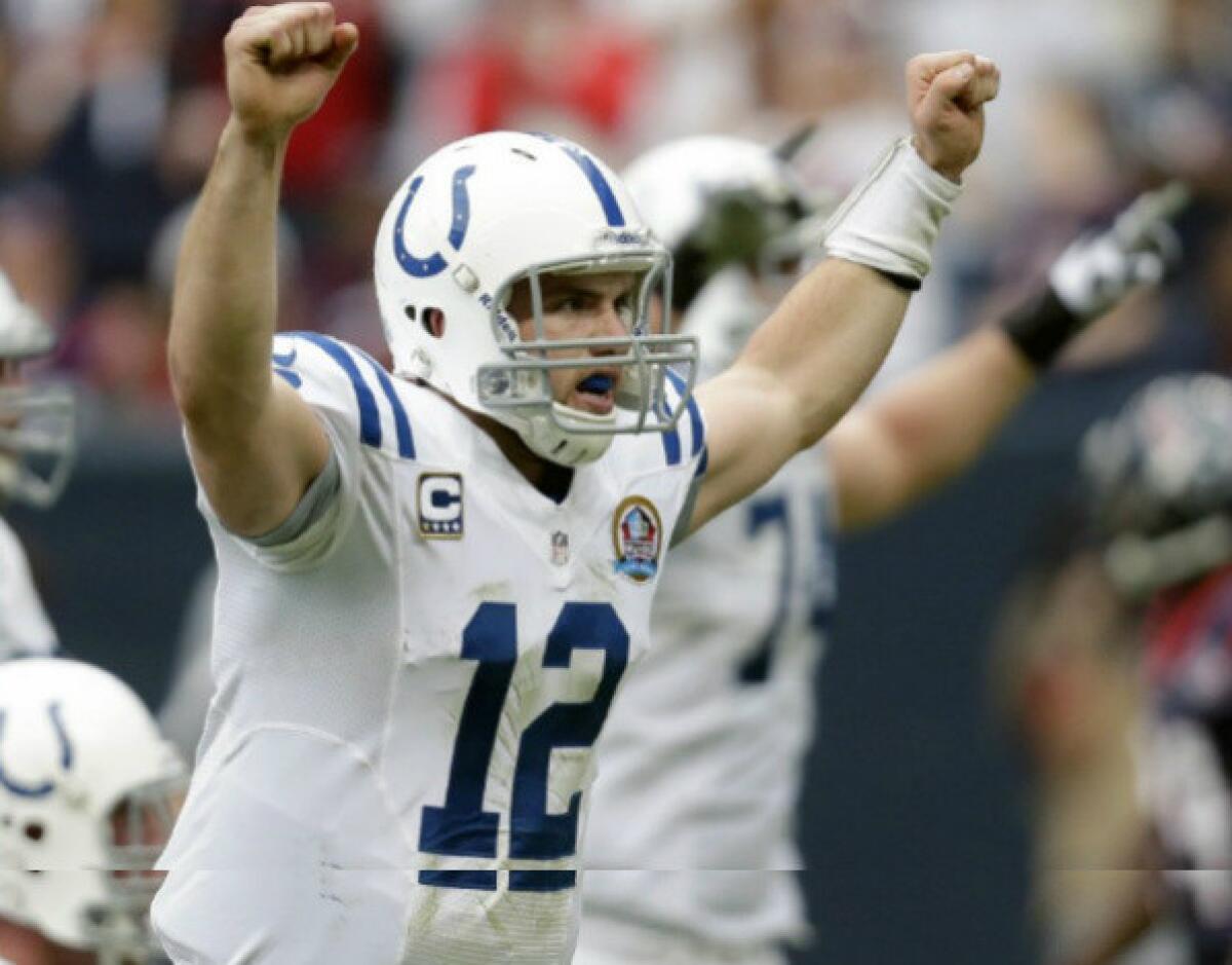 Indianapolis Colts quarterback Andrew Luck reacts after throwing a touchdown pass to Dwayne Allen in the third quarter of their game against the Houston Texans.