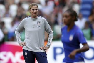 FILE - In this July 7, 2019, file photo, United States coach Jill Ellis, left, watches the players warm-up.
