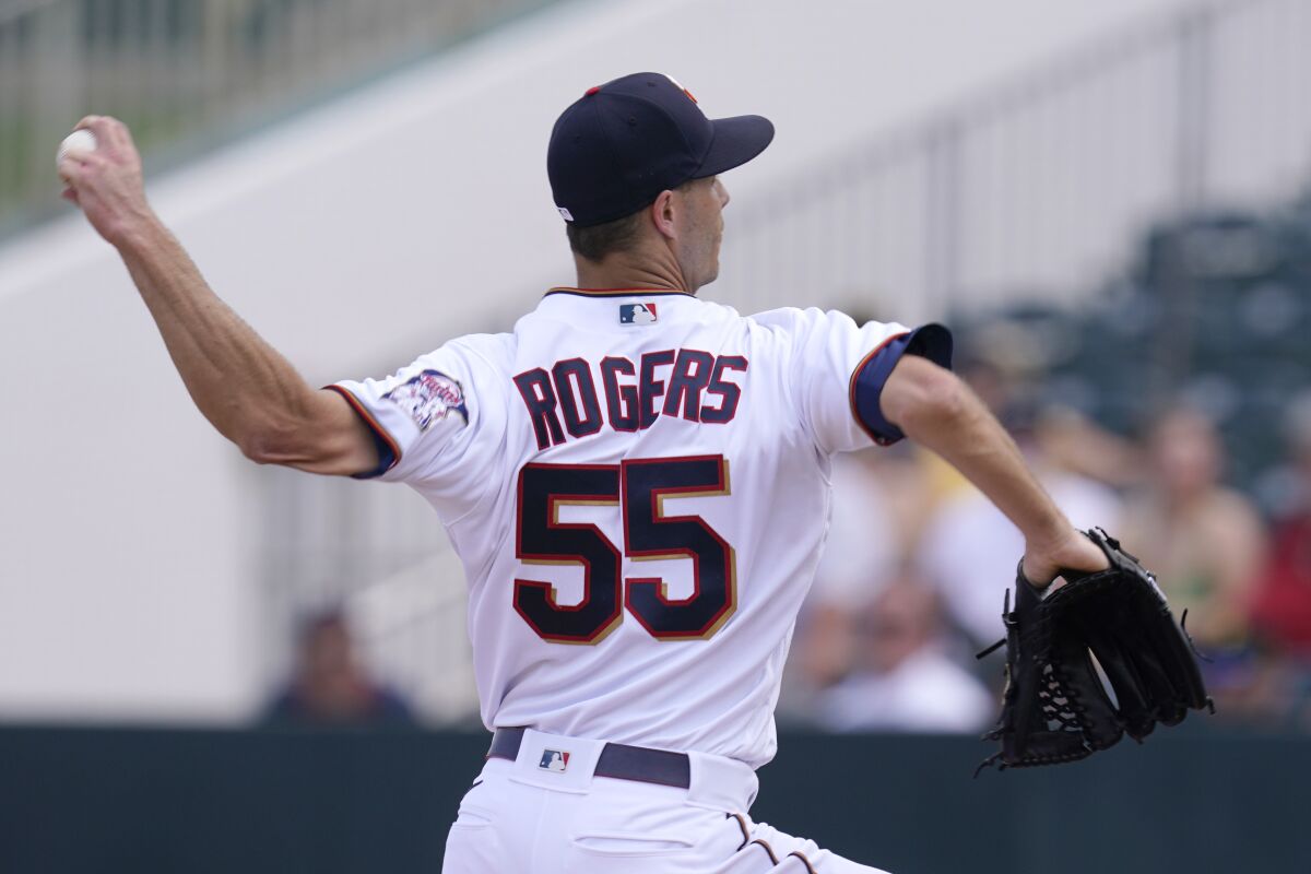 Minnesota Twins relief pitcher Taylor Rogers (55) delivers a pitch in the top of the fourth inning during a spring training baseball game against the Pittsburgh Pirates at the Hammond Stadium Wednesday March 30, 2022, in Fort Myers, Fla. (AP Photo/Steve Helber)