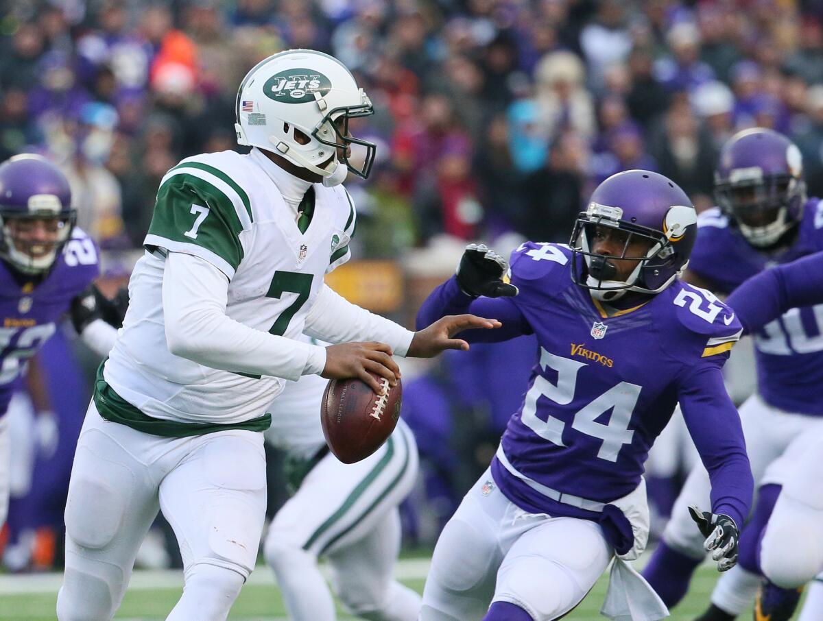 New York Jets quarterback Geno Smith is pressured by Minnesota's Captain Munnerlyn on Dec. 7.