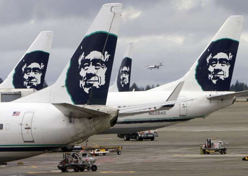 Citing smoke from wildfires, Alaska Airlines suspended flights in and out of Portland and Spokane for 24 hours.