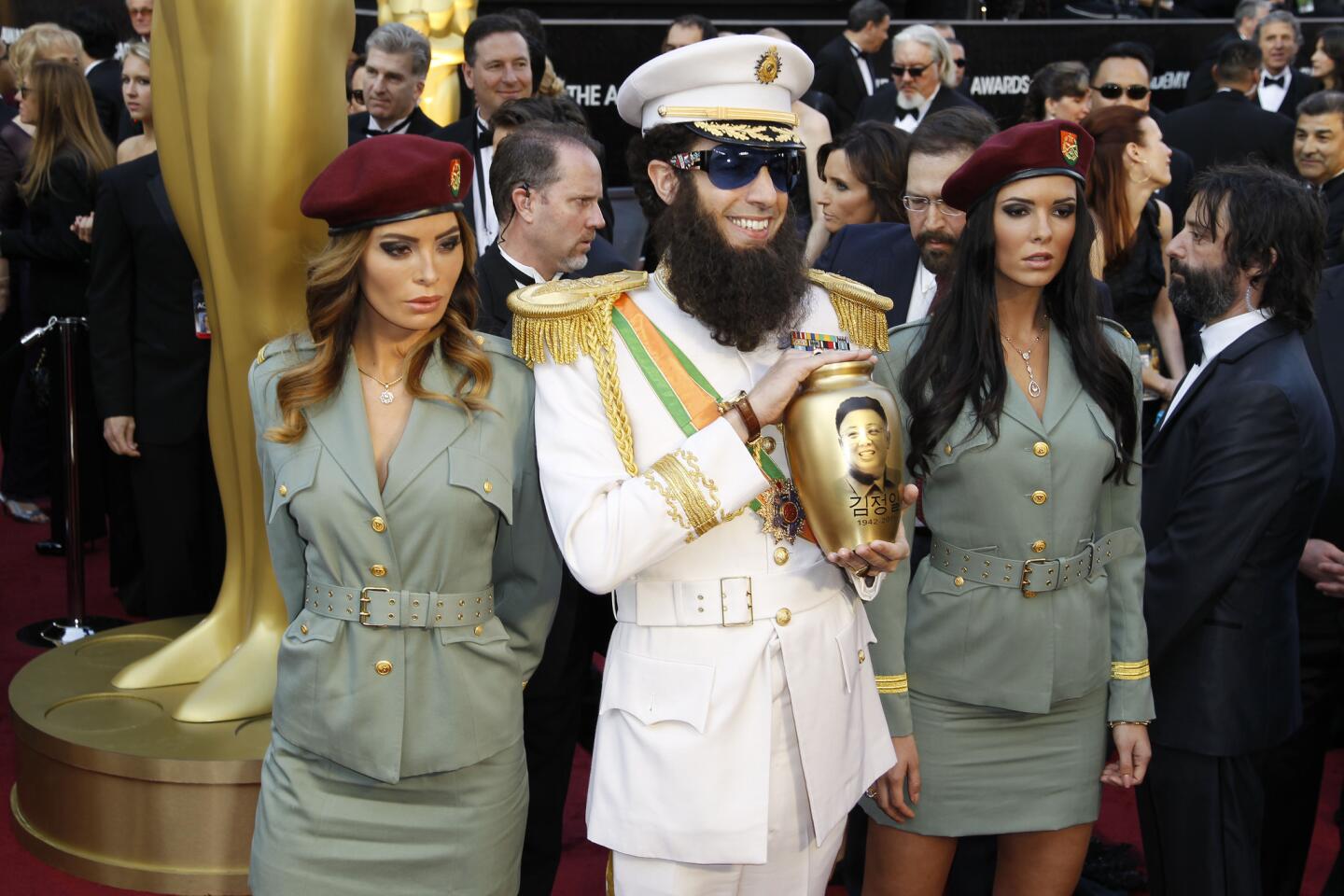 Sacha Baron Cohen walked the red carpet of the 84th Academy Awards in character as General Aladeen from his film "The Dictator." He also carried a gold urn he claimed contained the ashes of former North Korean leader Kim Jong-Il, which he dumped over Ryan Seacrest.