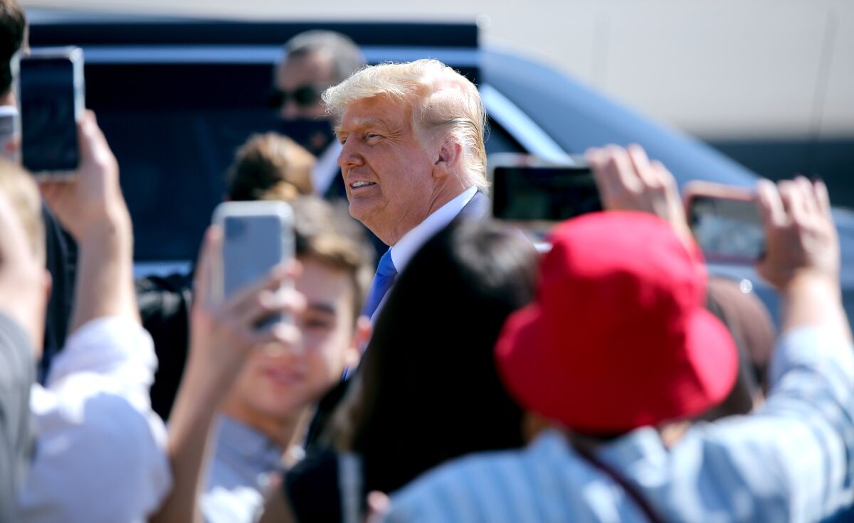 President Trump greets supporters Sunday on the tarmac at John Wayne Airport in Santa Ana.