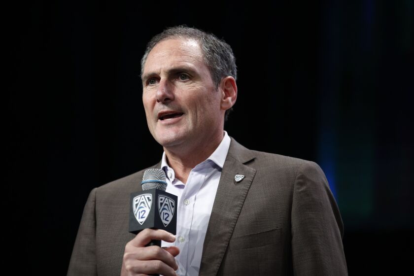 Pac-12 commissioner Larry Scott speaks at the Pac-12 Conference NCAA college football Media Day.