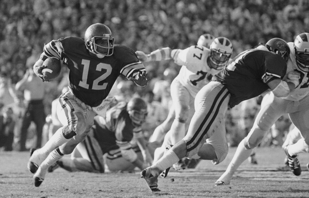 USC tailback Charles White carries the ball against Michigan during the Rose Bowl.