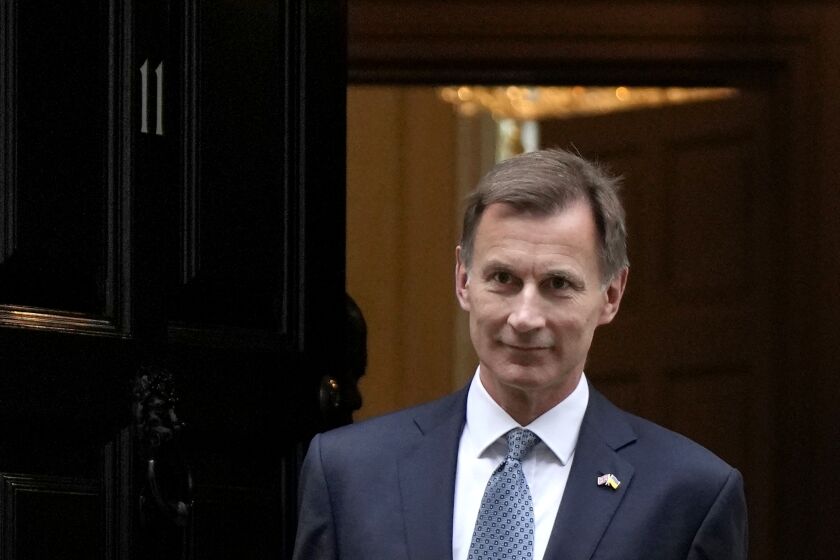 FILE - Britain's Chancellor Jeremy Hunt leaves 11 Downing Street to attend Parliament in London, Thursday, Nov. 17, 2022. Britain’s Treasury chief said Friday, Jan. 27, 2023, that taming inflation is more important than cutting taxes, resisting calls from some in the governing Conservative Party for immediate tax breaks for businesses and voters. (AP Photo/Alastair Grant, File)