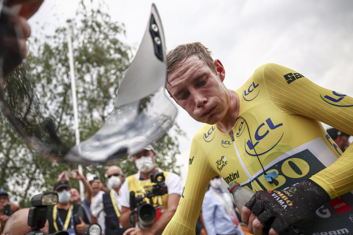 Stage winner and overall leader Denmark's Jonas Vingegaard reacts after the sixteenth stage of the Tour de France cycling race, an individual time trial over 22.5 kilometers (14 miles) with start in Passy and finish in Combloux, France, Tuesday, July 18, 2023. (Anne-Christine Poujoulat/Pool Photo via AP)