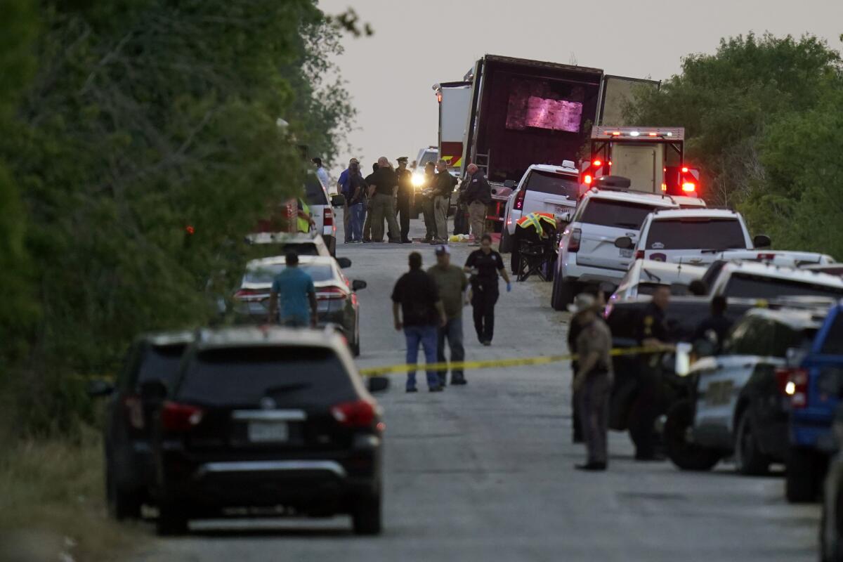 Police and other first responders at scene of tractor-trailer deaths