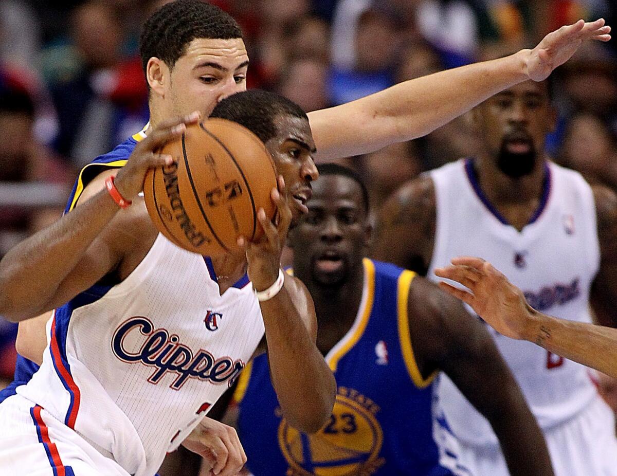 Clippers point guard Chris Paul drives past Warriors guard Klay Thompson in the fourth quarter.