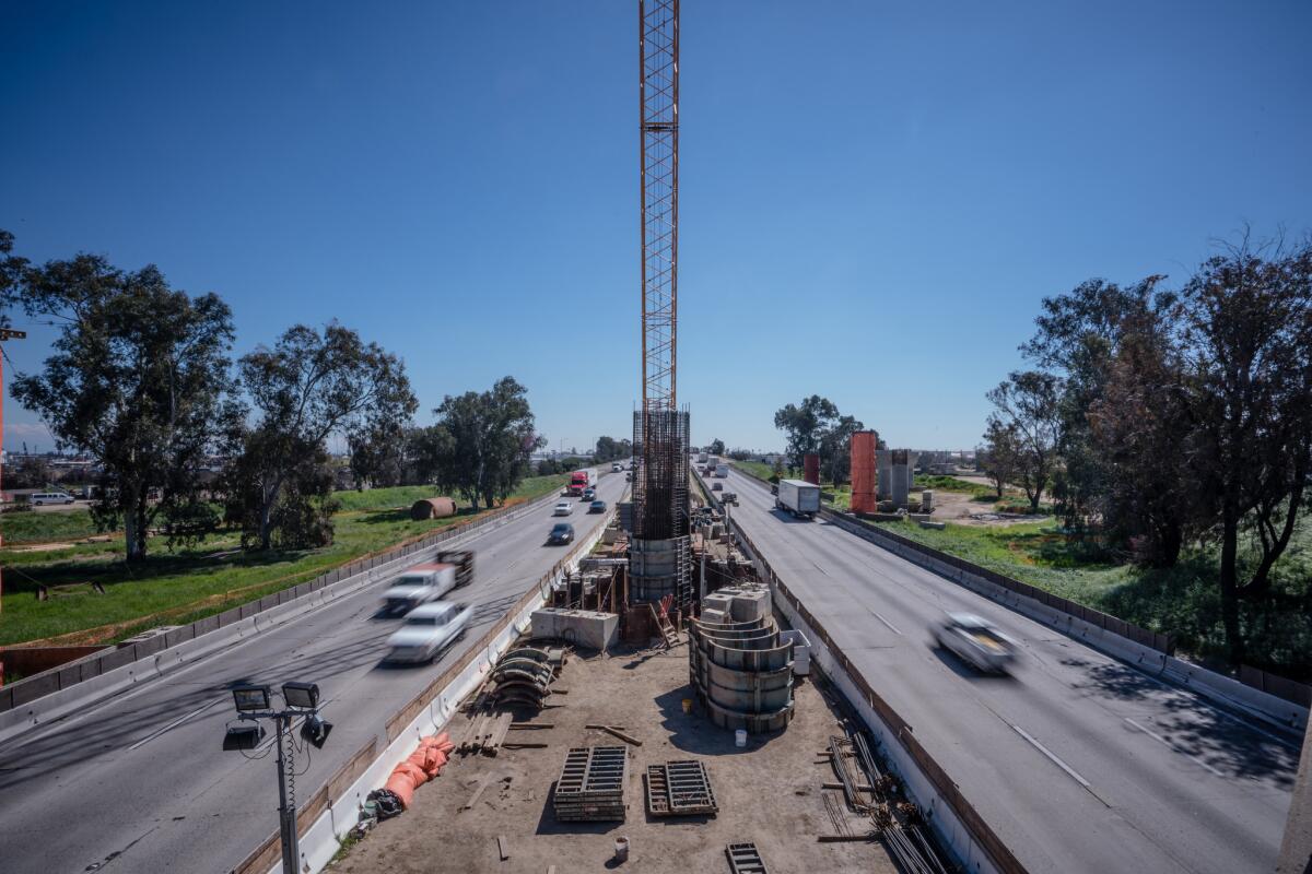 Traffic on Highway 99 passes high speed rail construction at the Cedar Viaduct in Fresno.