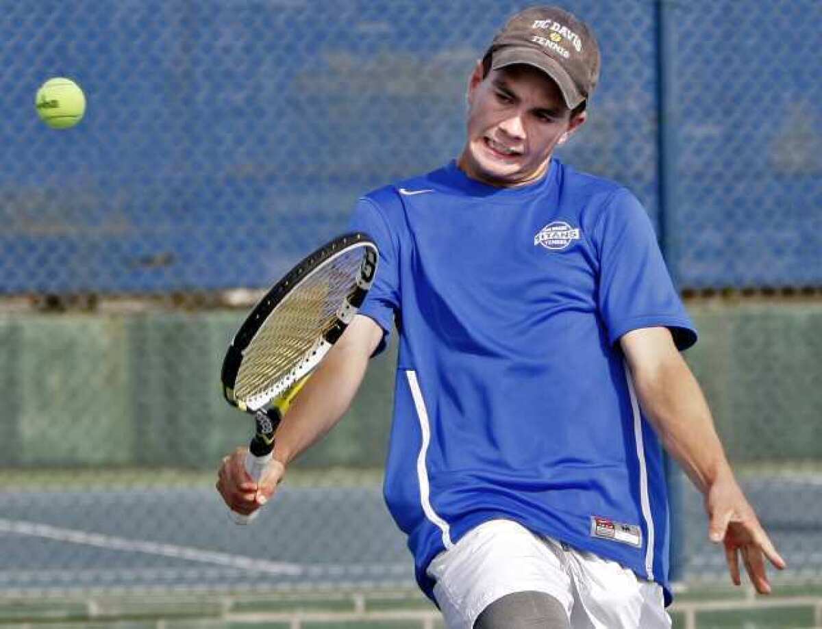 San Marino High School's tennis player James Wade returns the ball during doubles match at home vs. La Canada High School in San Marino on Thursday, March 28, 2013. (Raul Roa/Staff Photographer)