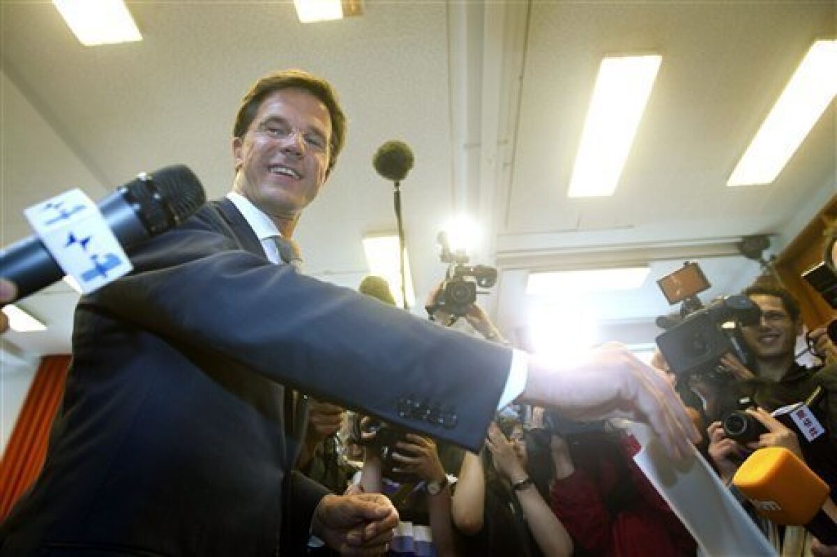 Conservative VVD party leader Mark Rutte casts his ballot for the general election, in The Hague, Netherlands, Wednesday June 9, 2010. Polls opened Wednesday in the Netherlands where Dutch voters will elect a new parliament after an election campaign focused on economic and immigration policy. The conservative VVD party and its leader Mark Rutte are leading in opinion surveys on a deficit-busting, tough-on-immigration platform. The anti-Islam Freedom Party and its leader Geert Wilders also hope to book large gains. (AP Photo/Evert-Jan Daniels)