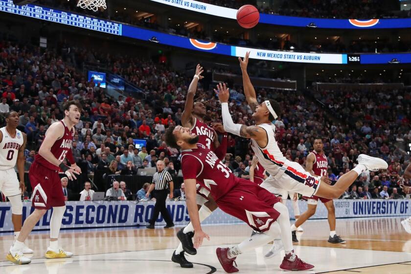 SALT LAKE CITY, UTAH - MARCH 21: Bryce Brown #2 of the Auburn Tigers shoots the ball against Johnny McCants #35 of the New Mexico State Aggies during the second half in the first round of the 2019 NCAA Men's Basketball Tournament at Vivint Smart Home Arena on March 21, 2019 in Salt Lake City, Utah. (Photo by Tom Pennington/Getty Images) ** OUTS - ELSENT, FPG, CM - OUTS * NM, PH, VA if sourced by CT, LA or MoD **