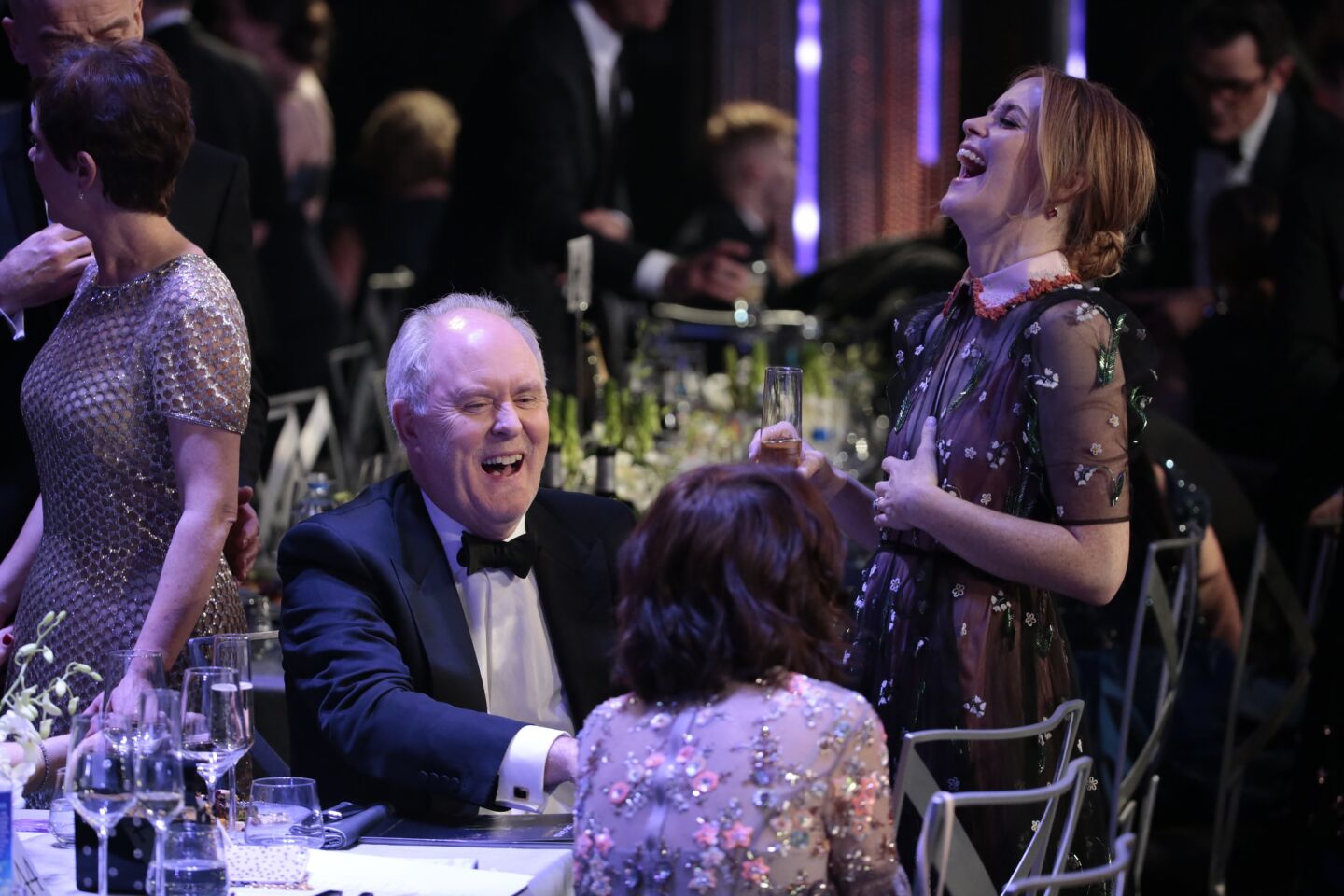Jon Lithgow shares a laugh with Claire Foy.