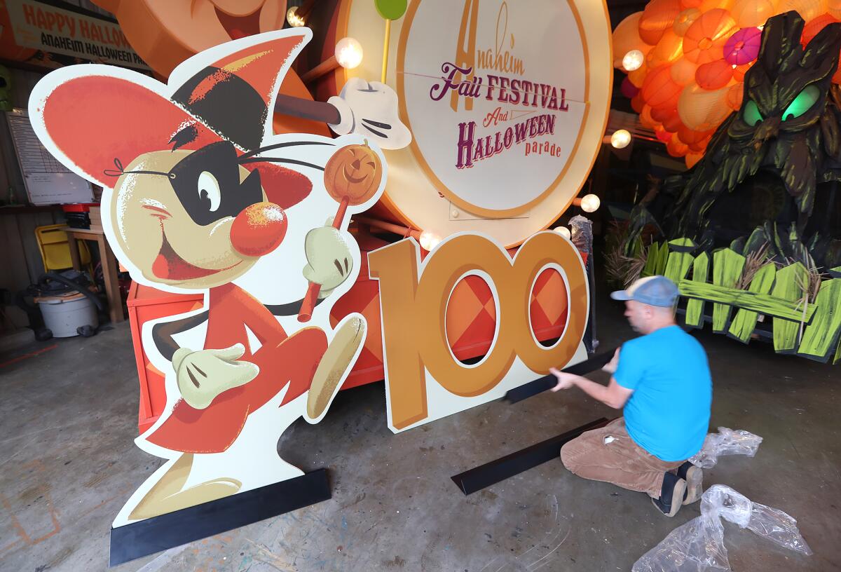 Jody Daily works on an Andy Anaheim float for the Anaheim Halloween Parade.