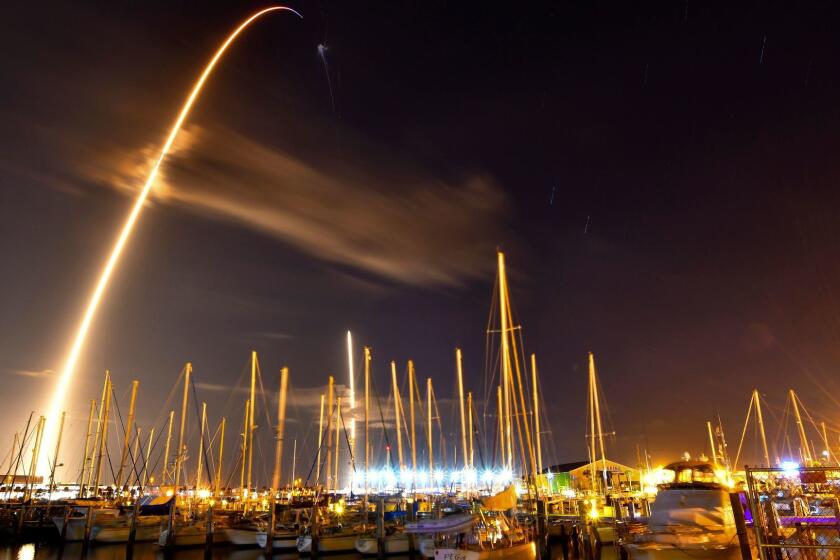 In this image made with an 8-minute long exposure the SpaceX Falcon 9 rocket launches from Cape Canaveral Air Force Station and lands as seen from from the Ocean Club Marina in Port Canaveral, Fla., Sunday, Jan. 7, 2018. On Sunday, SpaceX has launched a secret satellite codenamed Zuma on its first flight of the new year. (Malcolm Denemark/Florida Today via AP)