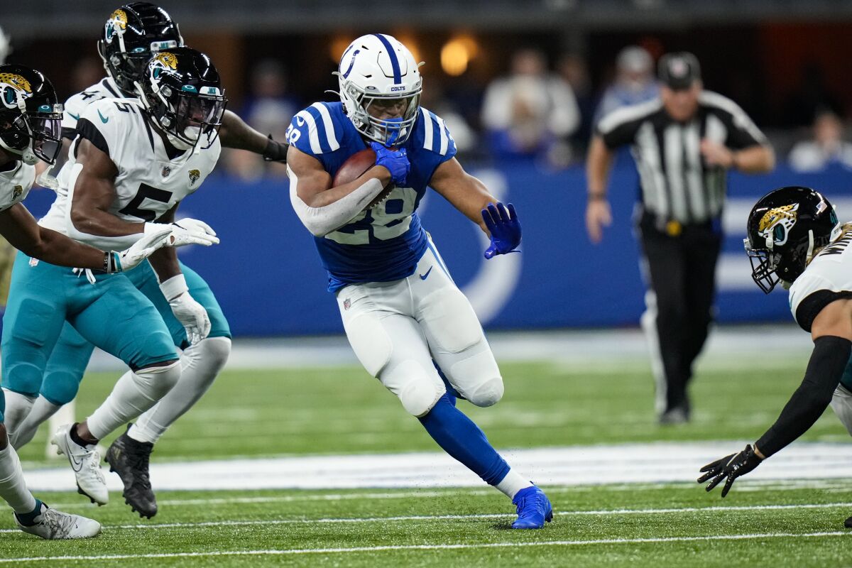 Indianapolis Colts running back Jonathan Taylor (28) runs against the Jacksonville Jaguars in the first half of an NFL football game in Indianapolis, Sunday, Nov. 14, 2021. (AP Photo/AJ Mast)