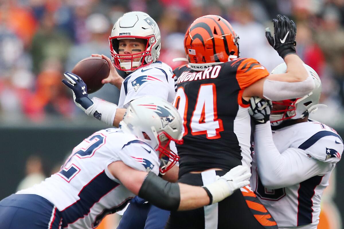 Patriots quarterback Tom Brady throws a pass during the first half of a win over the Cincinnati Bengals on Sunday.