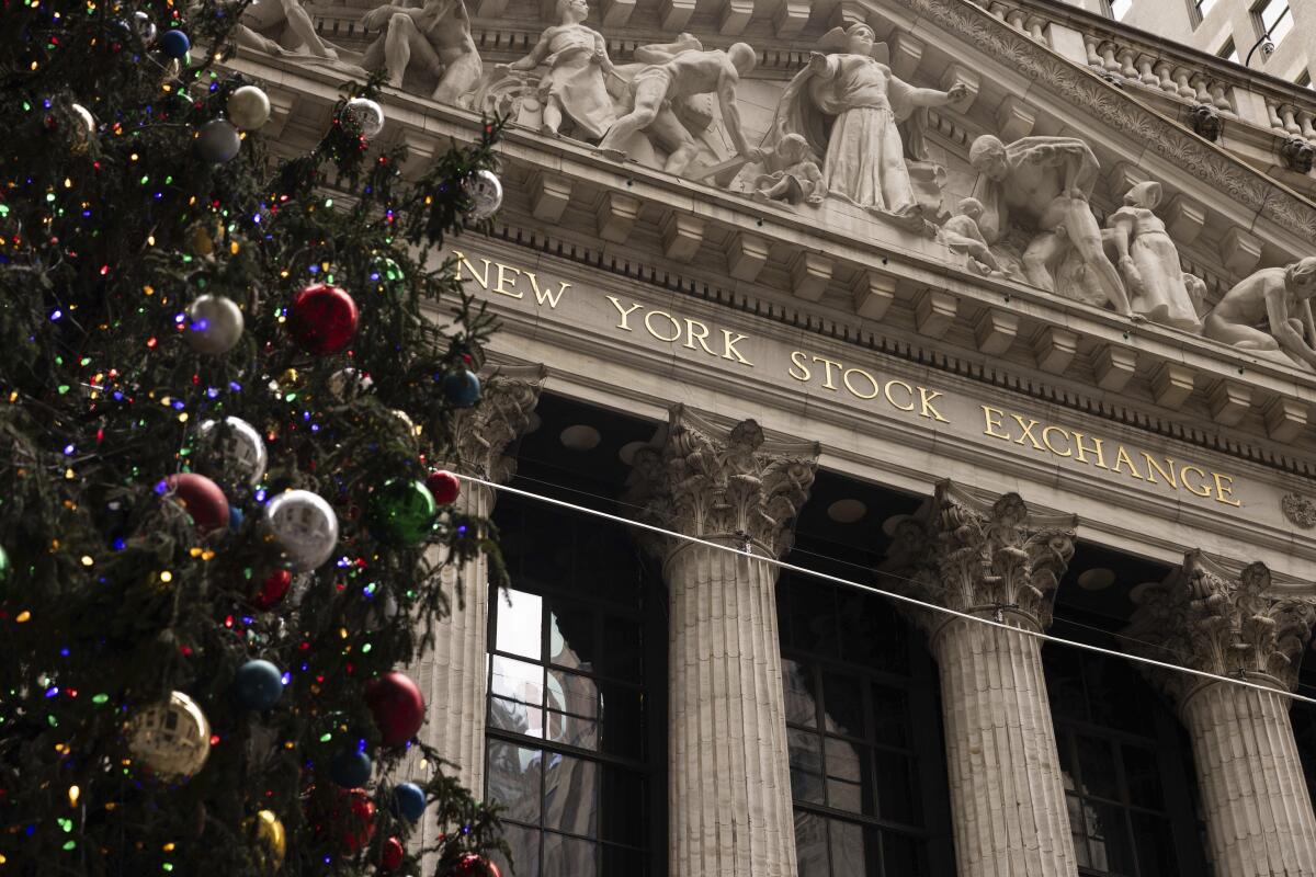 A Christmas tree stands in front of the New York Stock Exchange