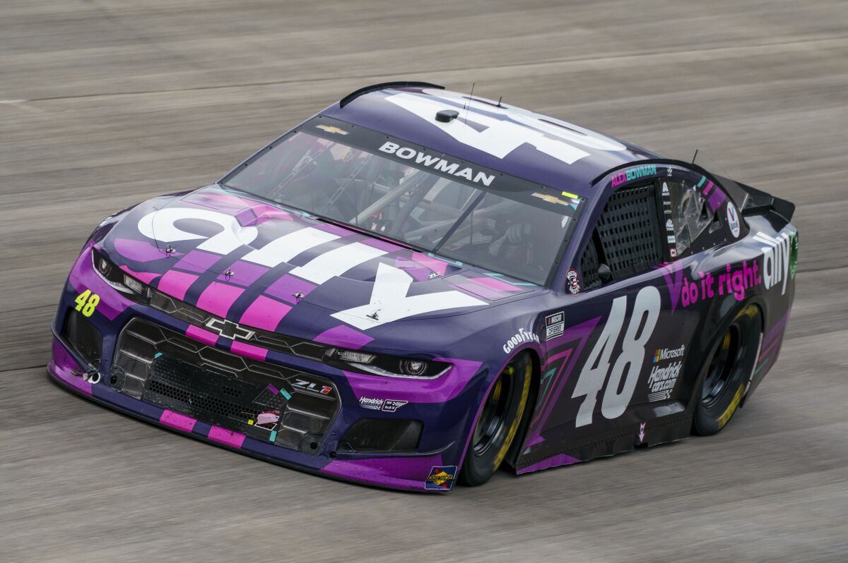 Alex Bowman races to victory at Dover International Speedway on Sunday.