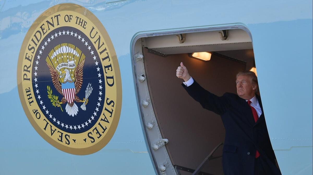 President Trump boards Air Force One for a trip to California on March 13.