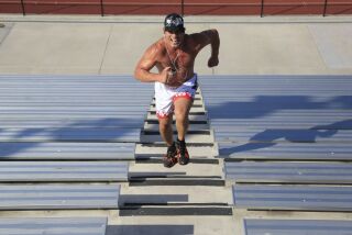 October 11th, 2014 Huntington Beach, CA- Mixed martial arts fighter Tito Ortiz runs the steps at Huntington Beach high school during a fifteen minute cardio workout. Photo by David Brooks/ U-T San Diego MANDATORY PHOTO CREDIT DAVID BROOKS / U-T SAN DIEGO; ZUMA Press.
