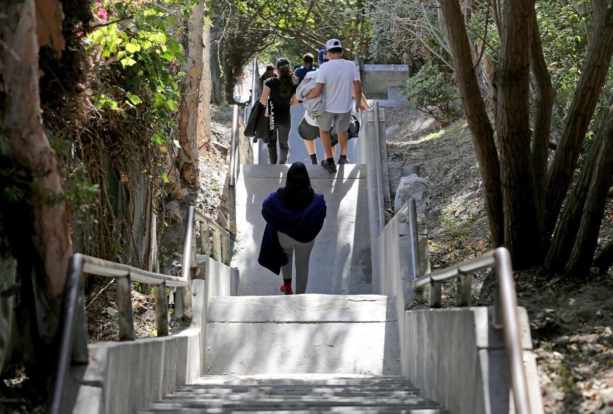 Beachgoers make the steep trek down to "Thousand Steps" beach.