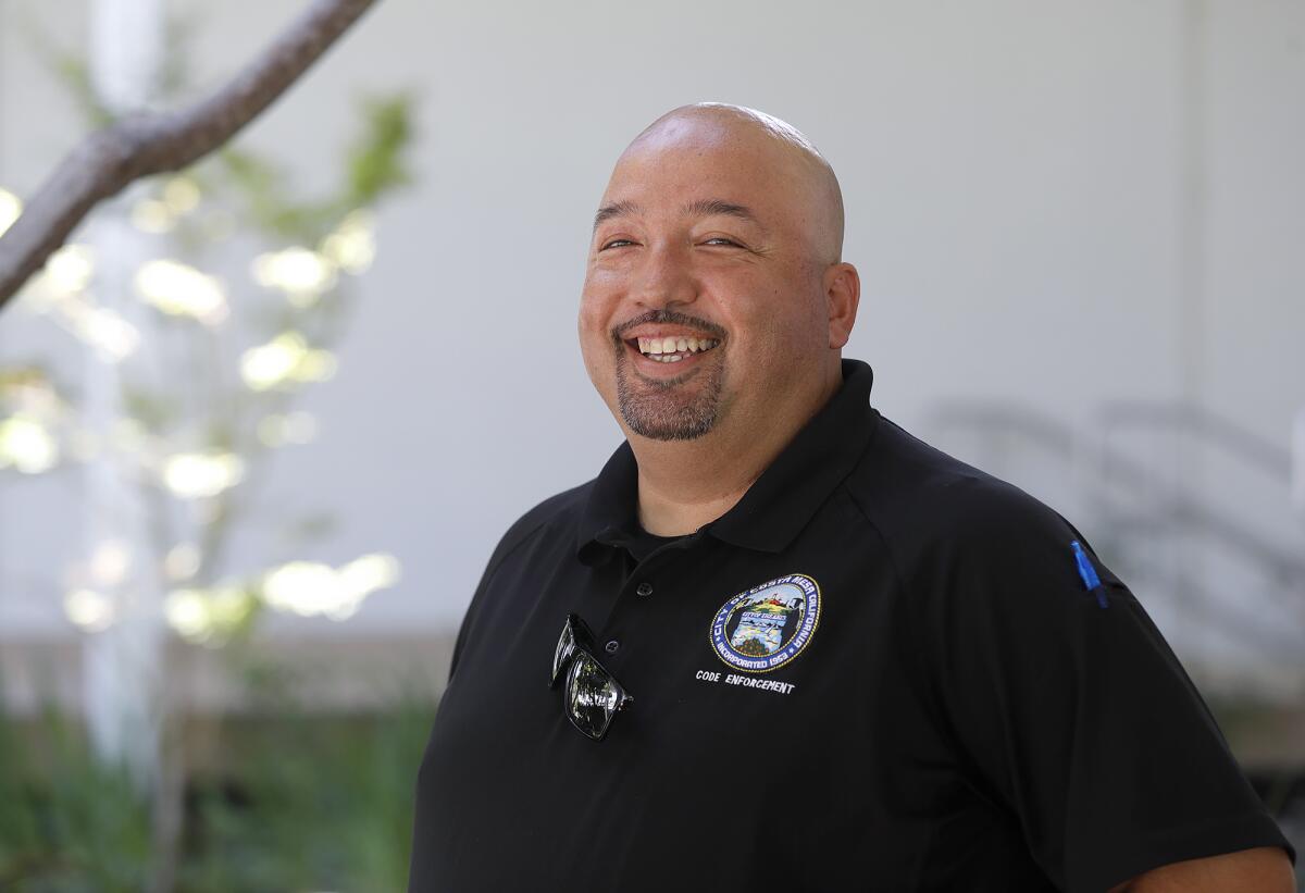 Andy Godinez, a code enforcement officer with the city of Costa Mesa, at City Hall on Thursday, July 20.
