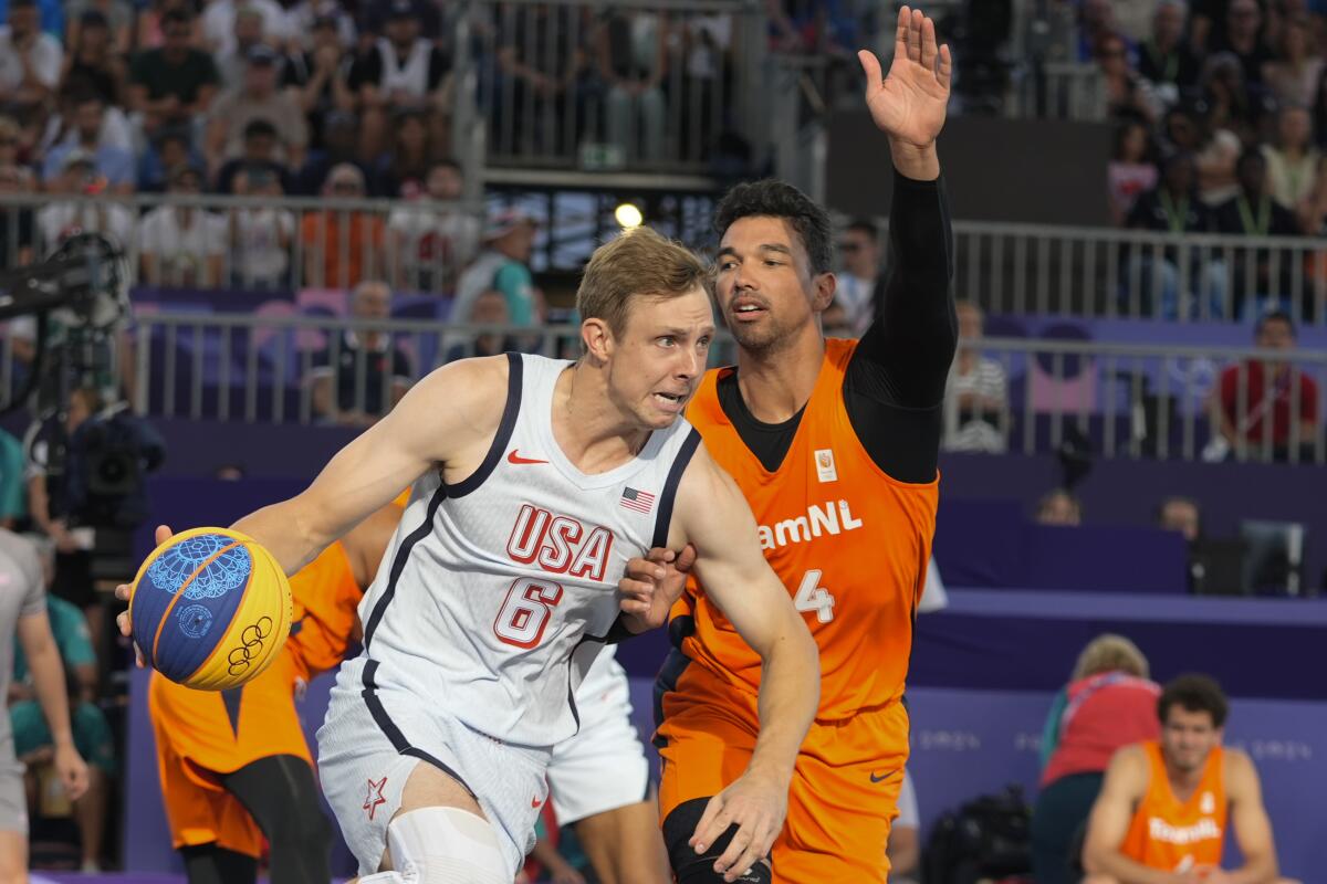 Arvin Slagter, of the Netherlands, defends American Canyon Barry during a men's 3x3 basketball pool round match Sunday. 