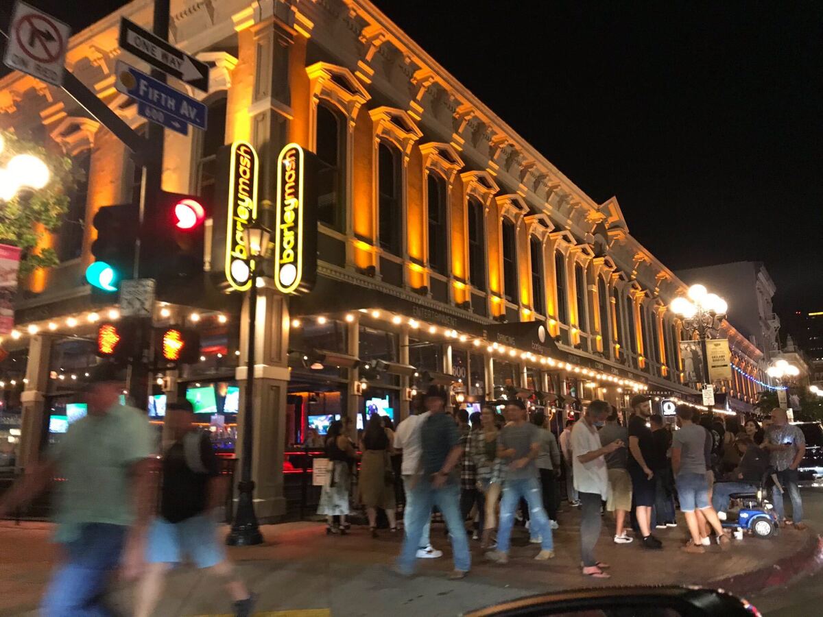 A crowd congregates in the Gaslamp Quarter Friday evening.