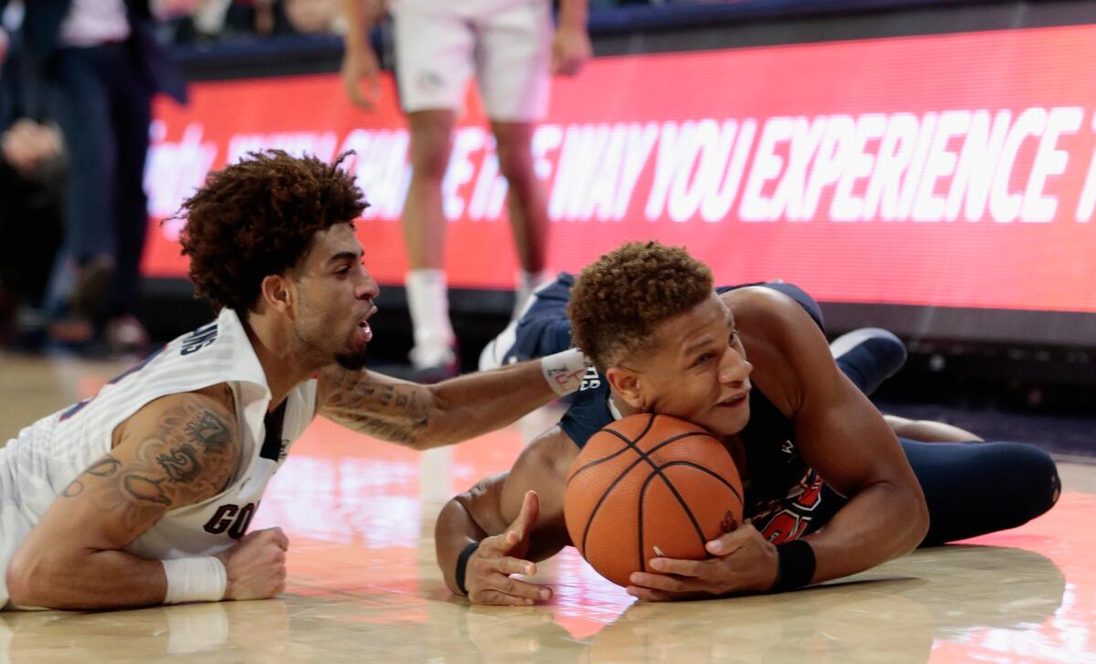 Pepperdine's Kameron Edwards, right, battles Gonzaga's Josh Perkins in 2018.