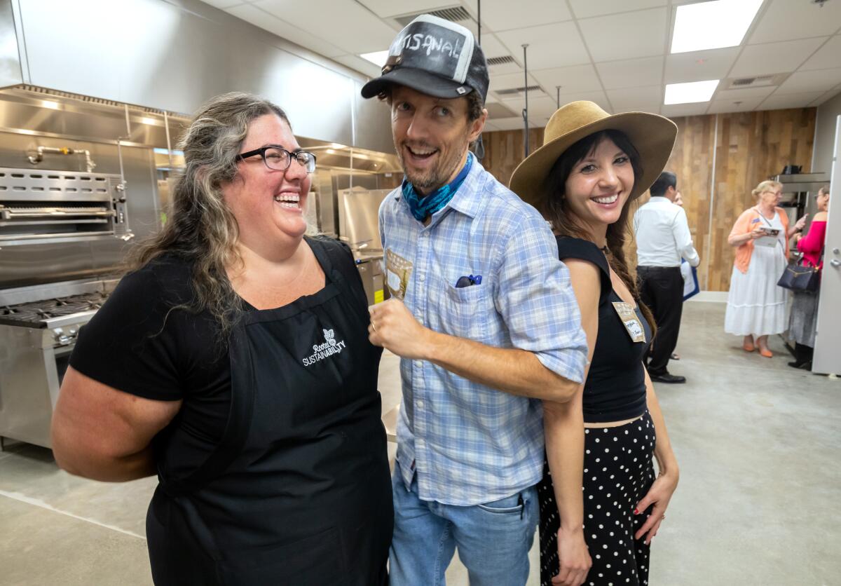 Jason Mraz and his wife, Christina Carano, right, with Vallie Gilley.
