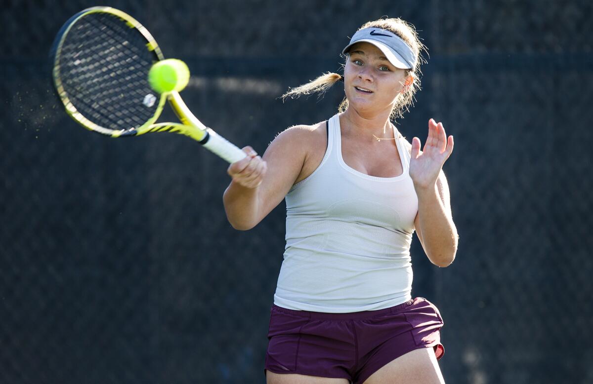Laguna Beach High freshman Jessica MacCallum is shown practicing at the Racquet Club of Irvine on Tuesday.