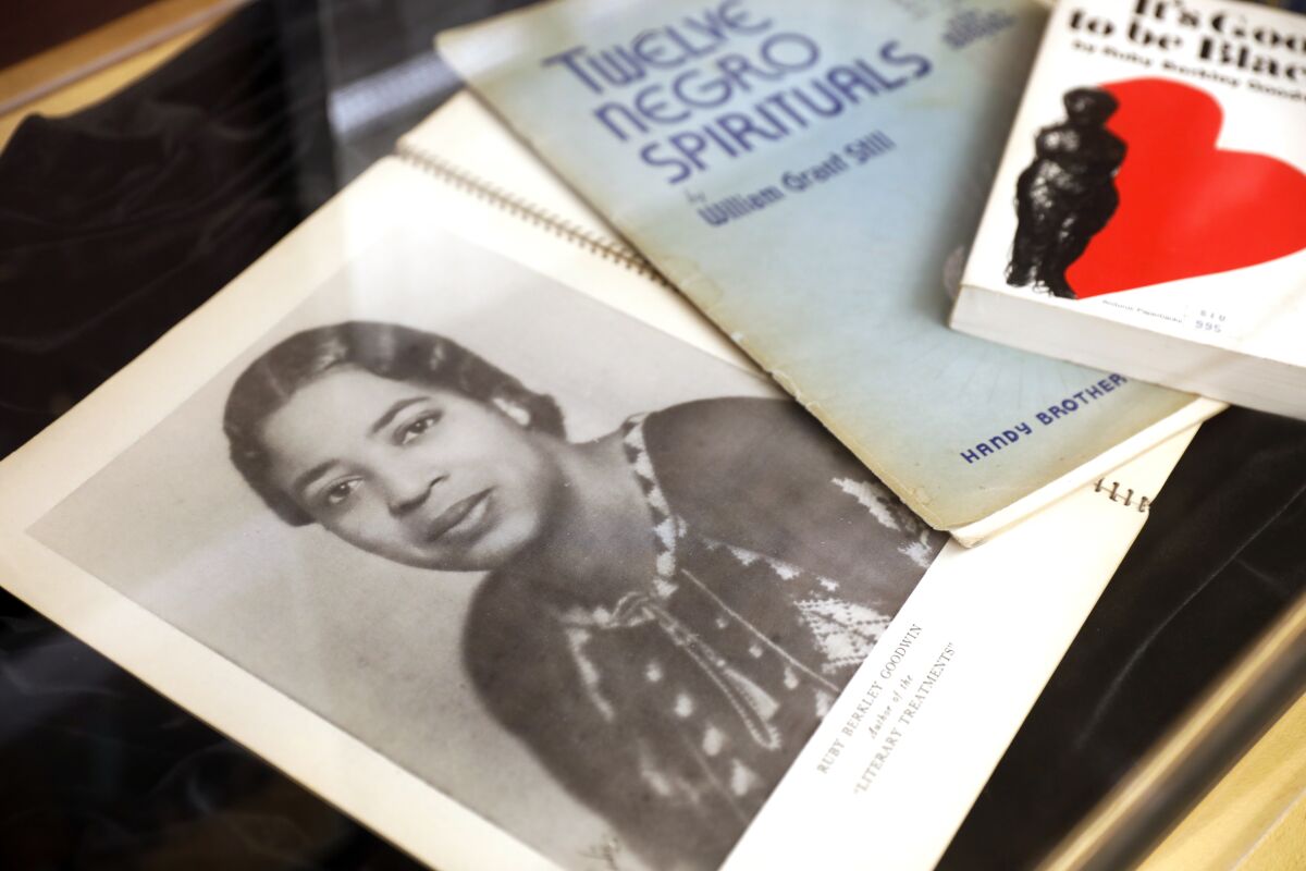 A song book, with a photo of curator Leah Goodwin's grandmother on the cover, part of an exhibit at the Women's Museum of California in Liberty Station.