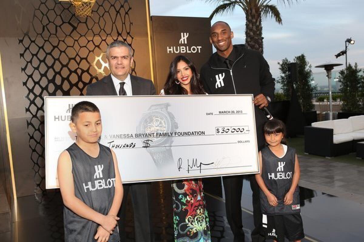 From left, Juan Valencia, Hublot CEO Ricardo Guadalupe, Vanessa Bryant, Kobe Bryant and Kimberly Martinez. Juan made two baskets and Kimberly one, earning Hublot's $30,000 donation to the Bryants' charitable foundation.