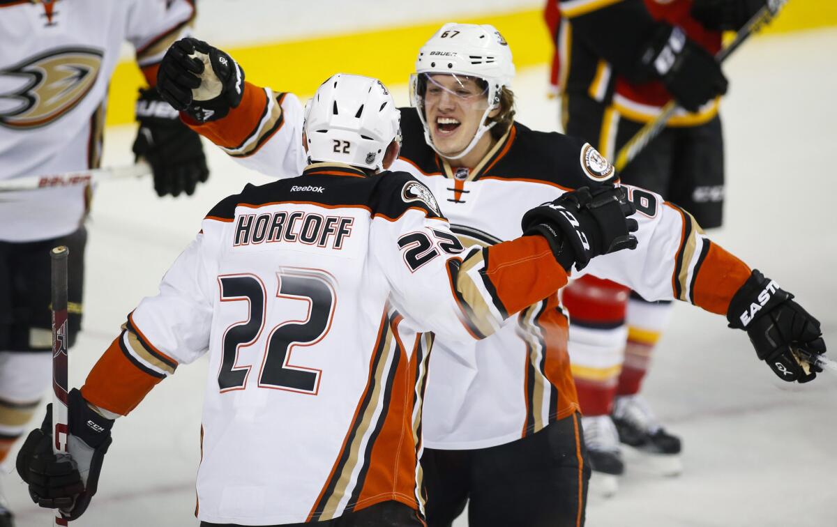 Ducks center Shawn Horcoff, left, celebrates his goal with teammate Rickard Rakell during the second period.