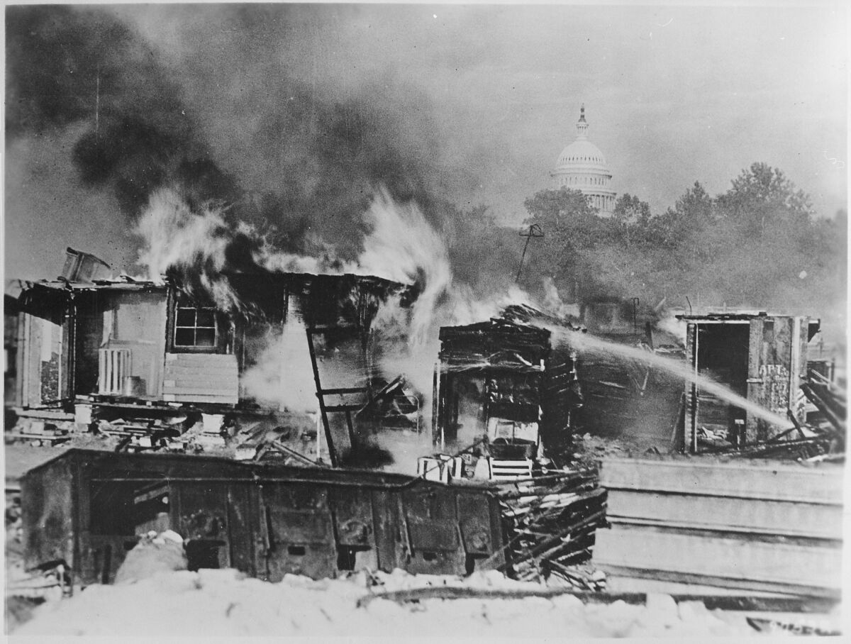 Gen. Douglas MacArthur's handiwork: the Bonus Marchers' encampment in flames in front of the U.S. Capitol, July 28, 1932.