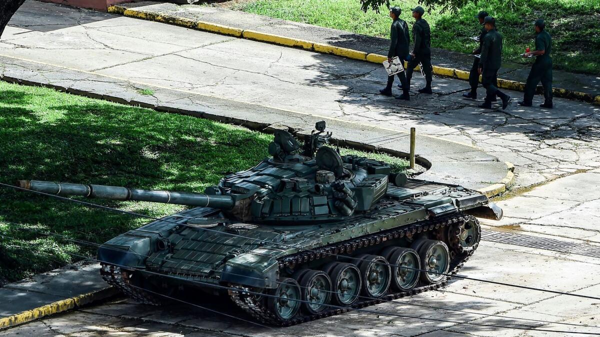 Soldiers are seen at Ft. Paramacay in Valencia, Venezuela, where authorities say troops put down an attack by an opposition group.