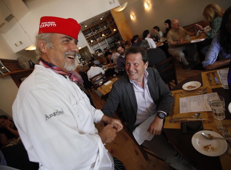 Chef Gino Angelini, left, of Angelini Osteria on Beverly Boulevard.