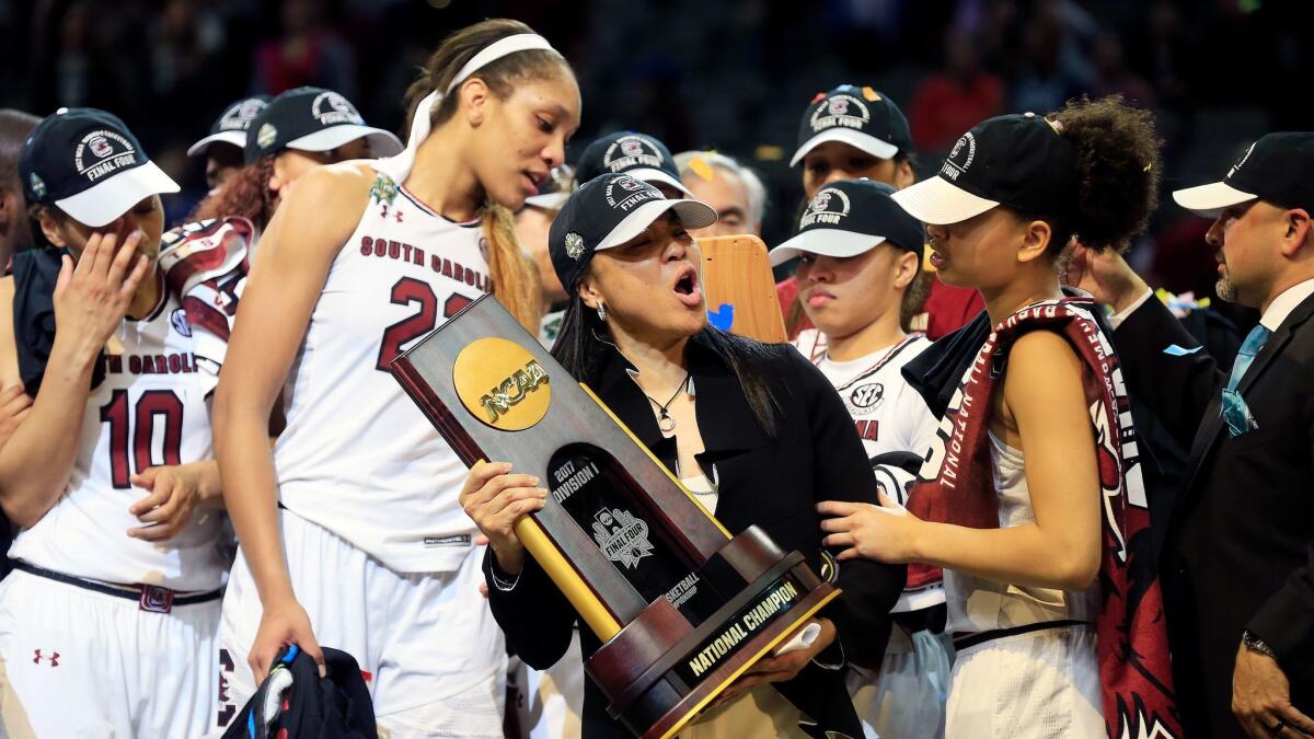 South Carolina Coach Dawn Staley holds the trophy after the Gamecocks' 67-55 win over Mississippi State in the NCAA women's championship game in Dallas on April 2.