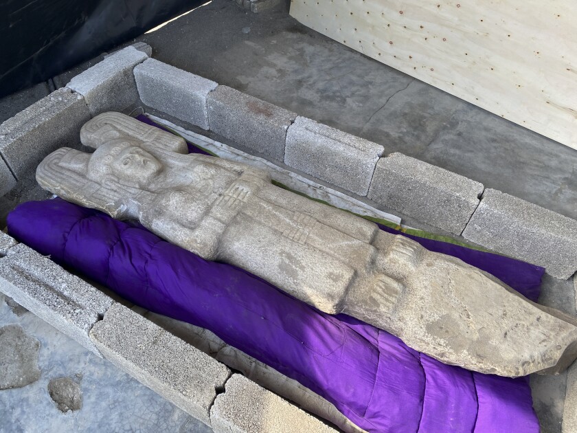 In this Jan. 4, 2021 photo released by Mexico's National Institute of Anthropology, known by its Spanish acronym INAH, the statue of a female figure unearthed in Hidalgo Amajac, is seen in nearby Alamo Temapache, Veracruz state, Mexico. Farmers digging in a citrus grove on New Year's Day found the six-foot tall statue of a female figure who may represent an elite woman rather than a goddess, or some mixture of the two, experts said Friday, Jan. 8, 2021. (Mexico's National Institute of Anthropology photo via AP)